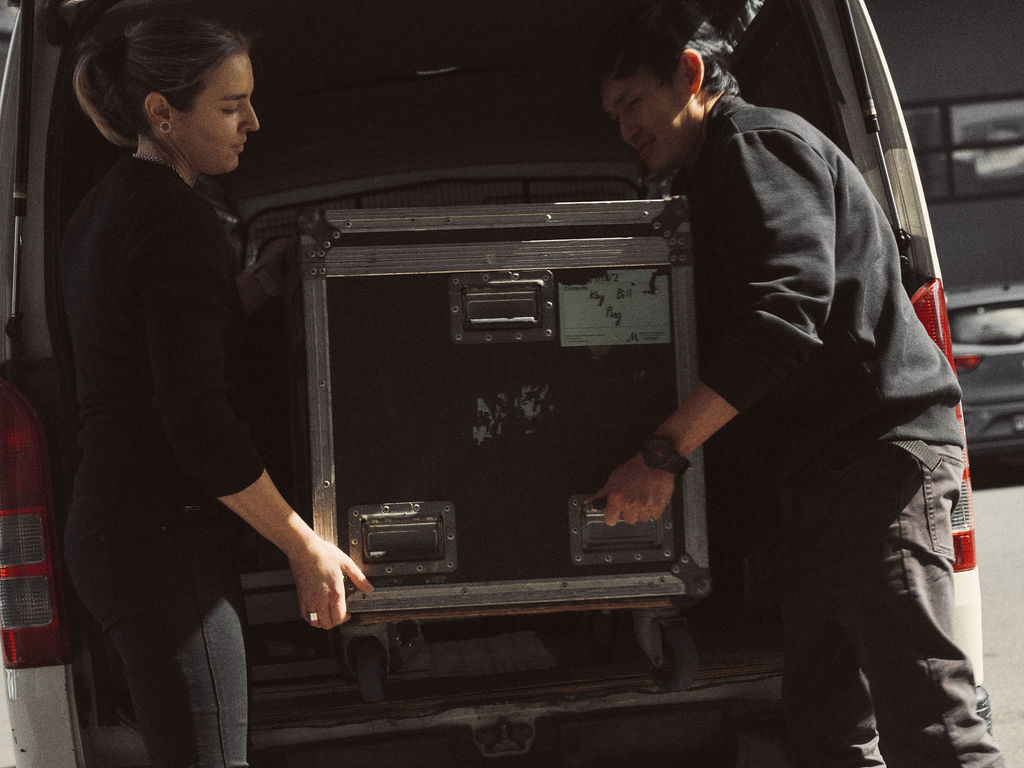 Multi crew preparing event equipment